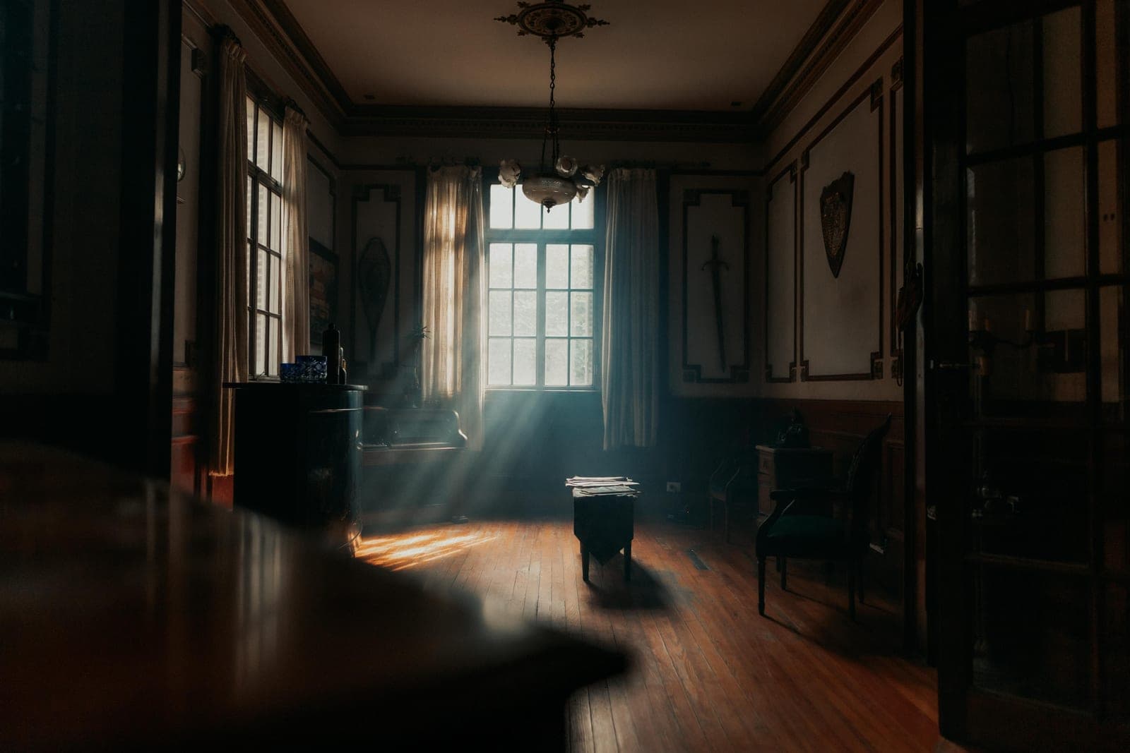 Afternoon light falling across a bedroom, showing dust suspended in the air